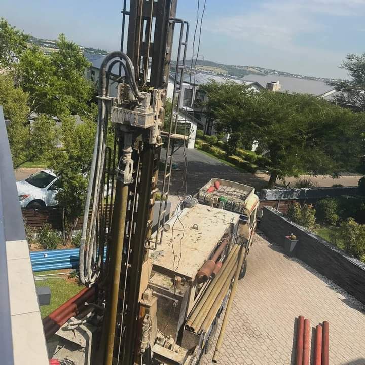 Active borehole drilling machinery during excavation